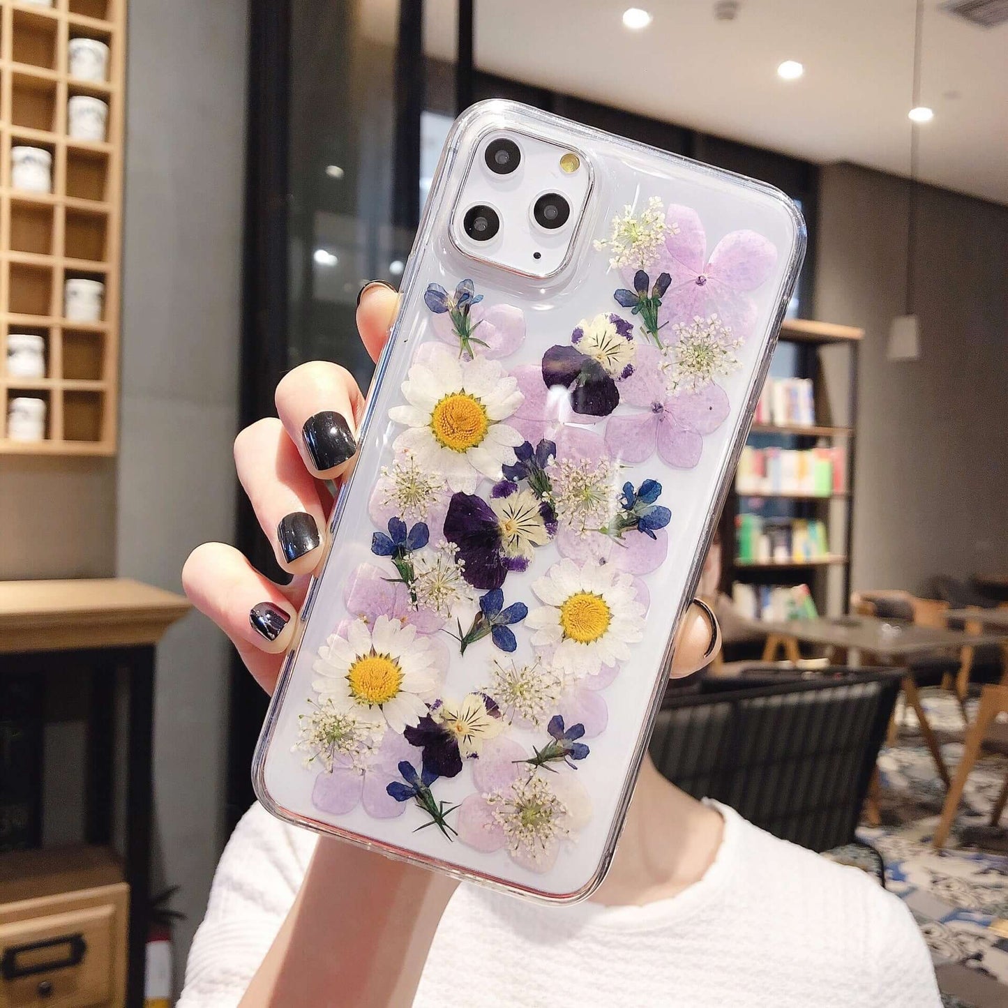 Preserved flower phone cases featuring beautiful floral designs on a clear epoxy phone case.
