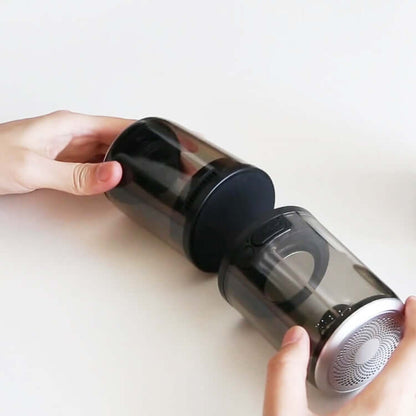 Bluetooth speaker magnetic transparent speaker showing hands holding two connected speakers with suction cups.