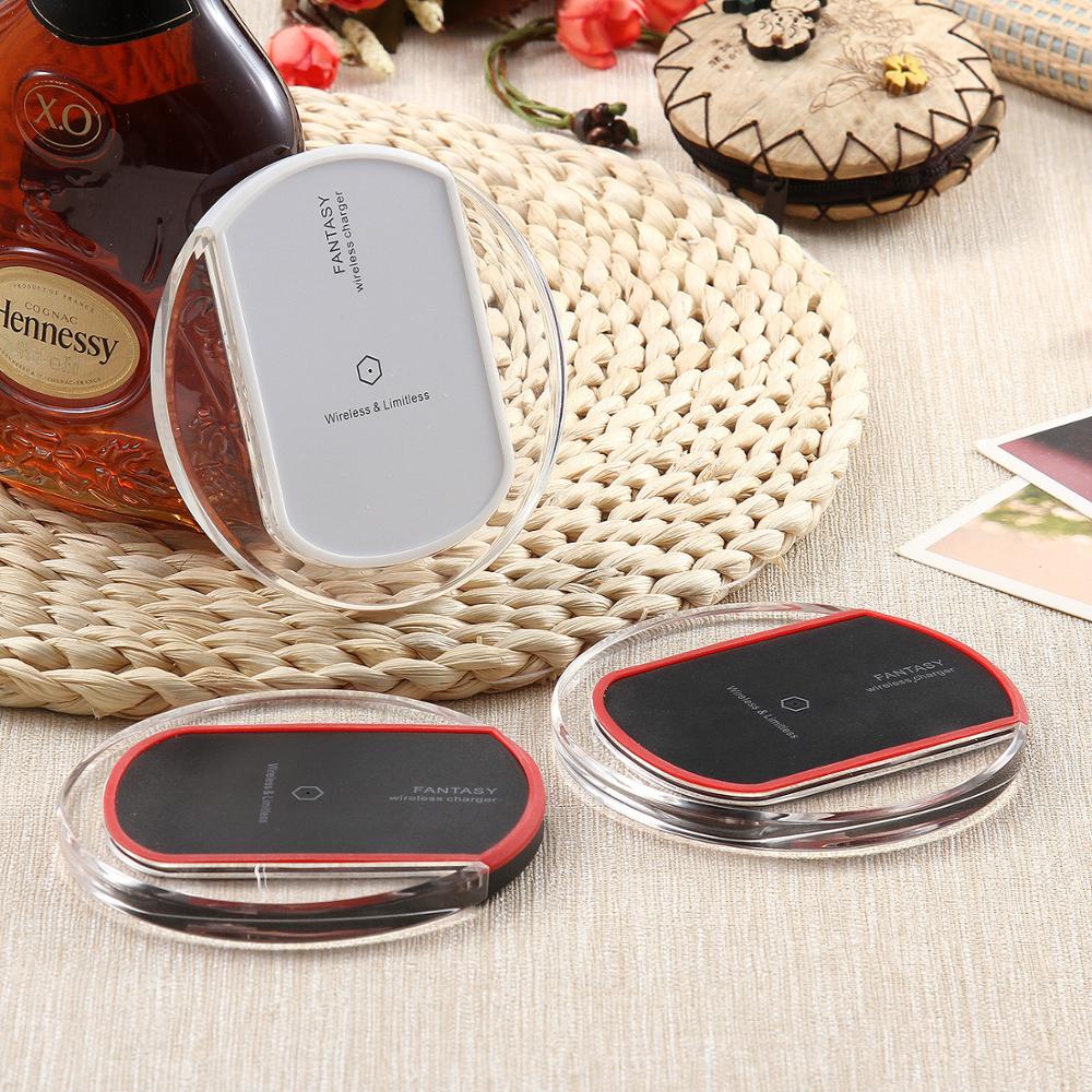 Wireless charger wireless receiver on a decorative woven surface with a bottle and photos.