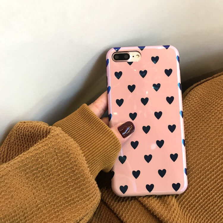 Pink blu-ray love heart phone case with black hearts on silicone back cover