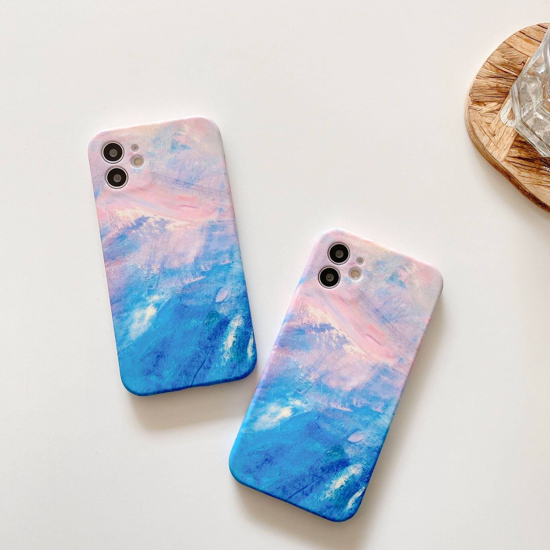 Artistic graffiti phone case with bold blue and pink abstract design for stylish mobile protection.