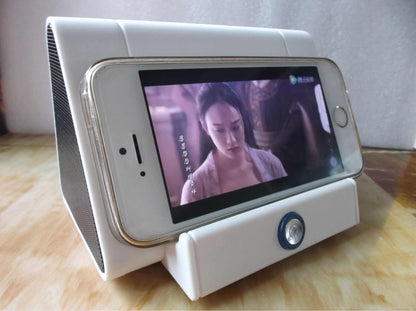 Smart Bluetooth Speaker with a smartphone holder displaying a video, showcasing its modern design and functionality.