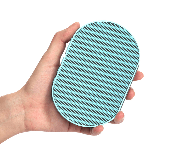 Bluetooth stereo smart speaker held in hand, showcasing compact design and stylish color.