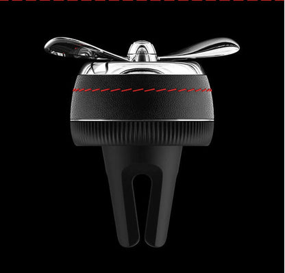 Car sesame oil diffuser clip-on air vent decoration in silver, black, and red colors.