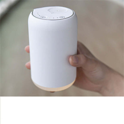 Handy Car Waterless Diffuser Desktop Humidifier in a person's hand, demonstrating its compact size and sleek design.