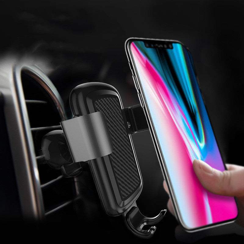 Car wireless charger mounted on a car air vent with a smartphone attached for convenient charging.