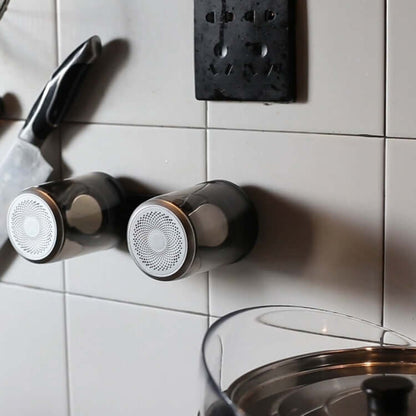 Bluetooth speaker magnetic transparent speaker mounted on kitchen tiles with modern design.
