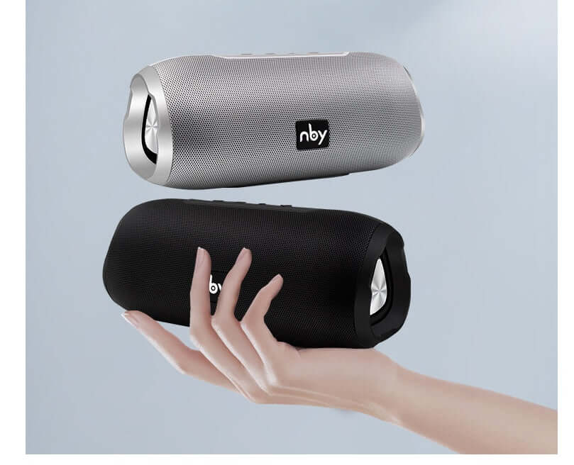 Bluetooth wireless speaker in hand, showcasing black and silver colors, portable design for easy use.