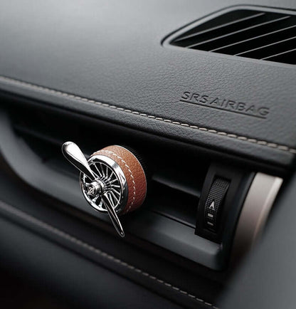 Car sesame oil diffuser attached to a car air vent for freshening up the car air.