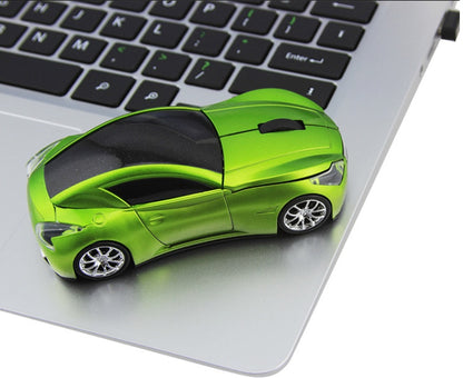 Creative Photoelectric Car Wireless Mouse Computer Accessories on a laptop keyboard in green color.