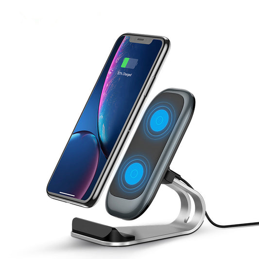 Mobile phone wireless charger with smartphone in charging position on a sleek stand.