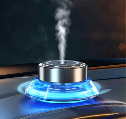 Smart Spray Car Mounted Fragrance Accessories emitting soothing mist and illuminated with blue light.