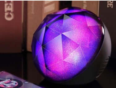 LED seven-color bluetooth speaker magic ball bluetooth speaker with vibrant colors and geometric design.