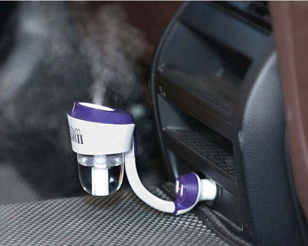 Car Aromatherapy Diffuser 50ml in use inside a vehicle, emitting mist from the air vent.