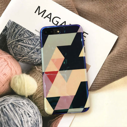 Blu-ray love heart phone case displayed on a magazine with colorful yarns in the background.