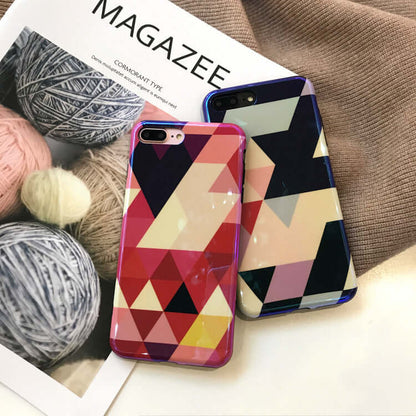 Blu-ray love heart phone case displayed on a magazine with colorful yarn balls in the background.