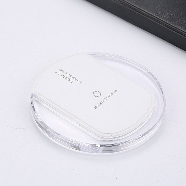 Wireless charger wireless receiver on a sleek, clear surface, showcasing modern design and QI compliance.