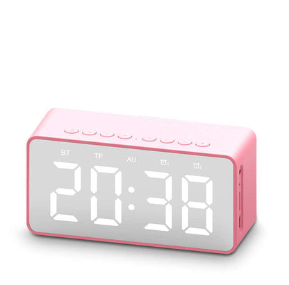 Alarm clock bluetooth speaker with pink design and large digital display showing time.