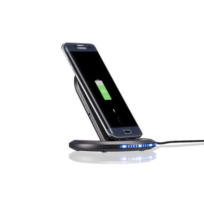 Mobile phone wireless charger bracket charger wireless charger fast charging wireless charger on a charging pad.