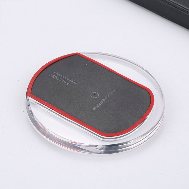 Wireless charger wireless receiver in sleek design with red trim and clear base on a white background.