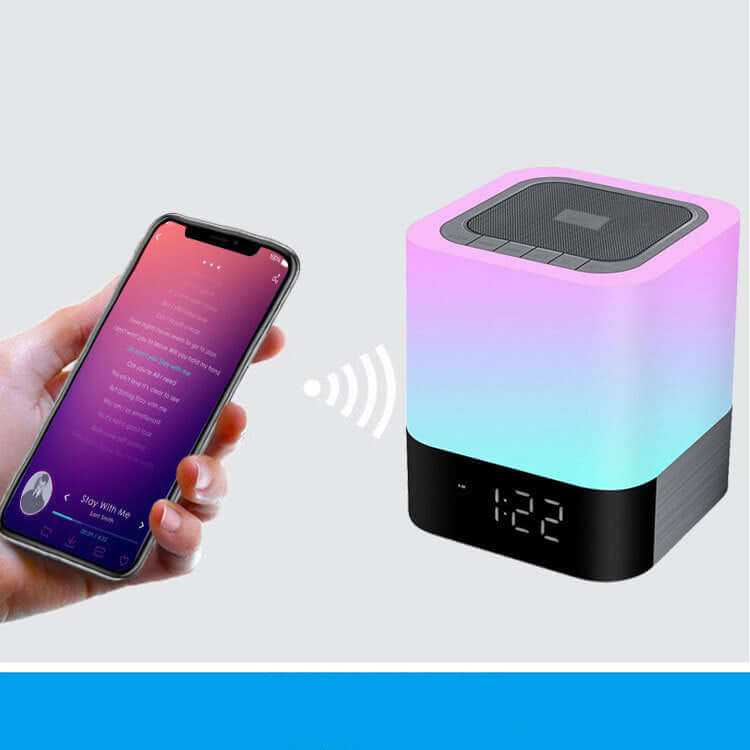 Bluetooth Speaker paired with a smartphone, featuring LED light and clock display.