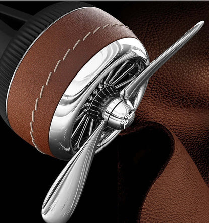 Car sesame oil diffuser with a sleek design featuring metal and leather accents for stylish car air freshening.