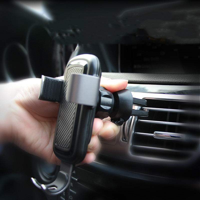 Car wireless charger mounted on car air vent, providing convenient access for charging on the go.