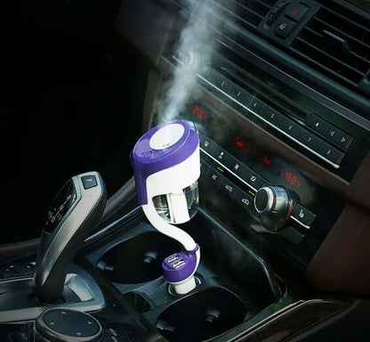 Car Aromatherapy Diffuser 50ml in a vehicle cup holder, emitting mist for a soothing experience.