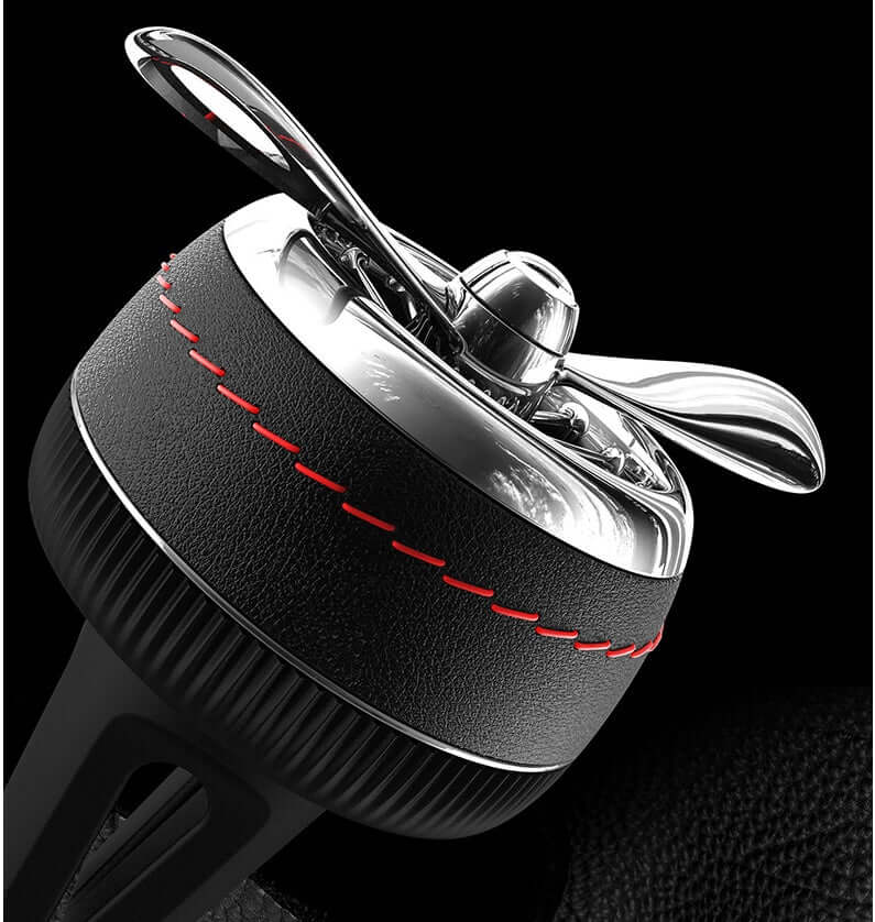 Car sesame oil diffuser clip-on for car vents, stylish design in silver and black, refreshing fragrance.
