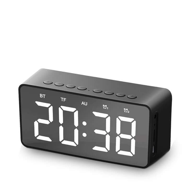 Alarm clock bluetooth speaker with digital display showing 20:38 and multiple function buttons.