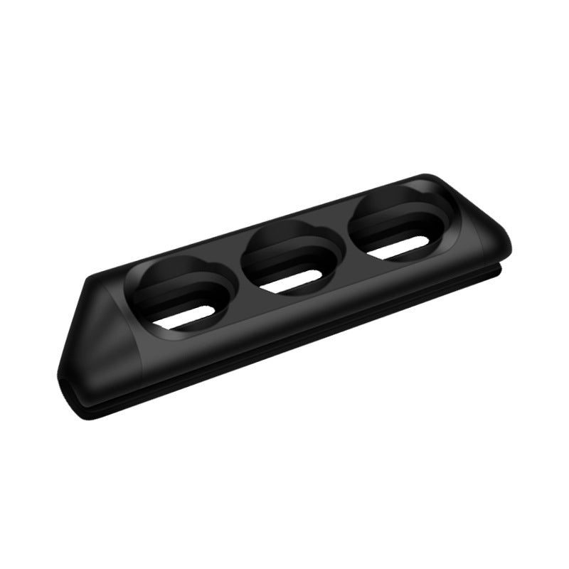 Magnetic charging cable holder with three slots for organized charging.