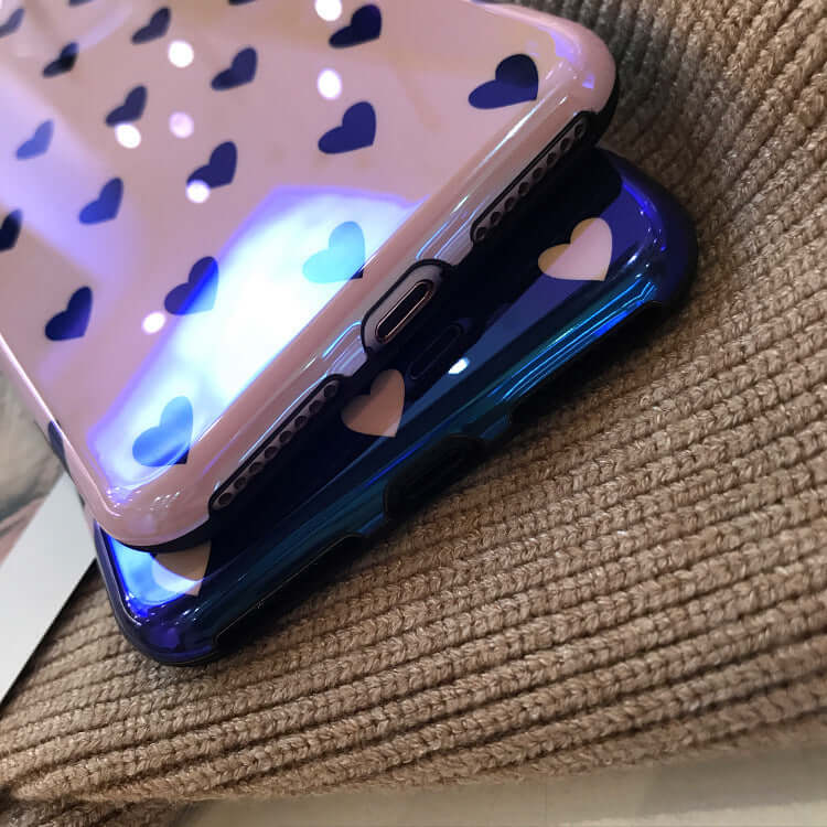 Two blu-ray love heart phone cases stacked, showcasing their stylish designs and soft silicone material.