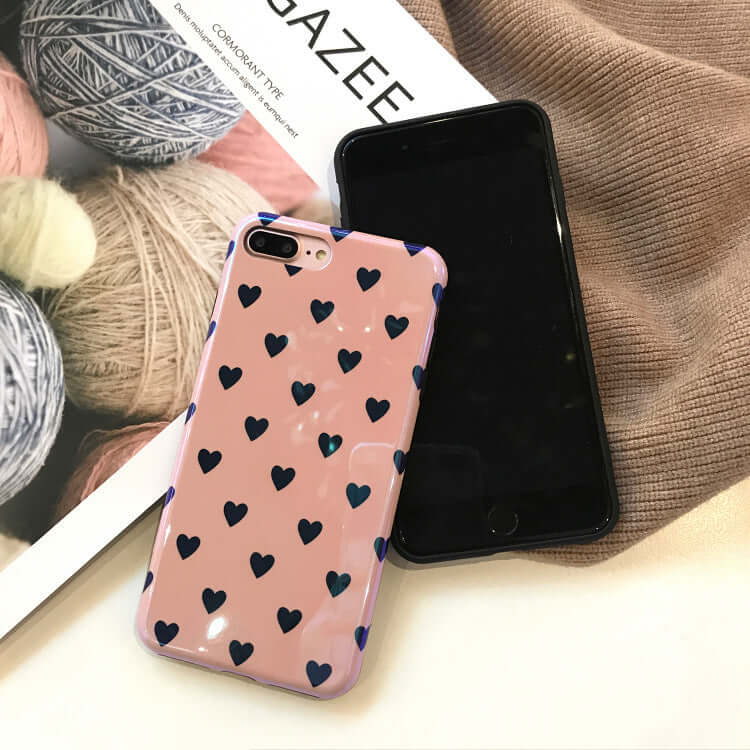 Blu-ray love heart phone case displayed on a table with yarn and magazine backdrop.