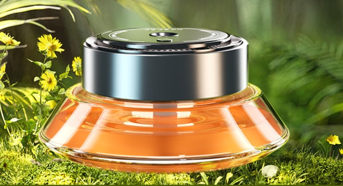 Smart Spray Car Mounted Fragrance Accessories in a lush green setting with yellow flowers.