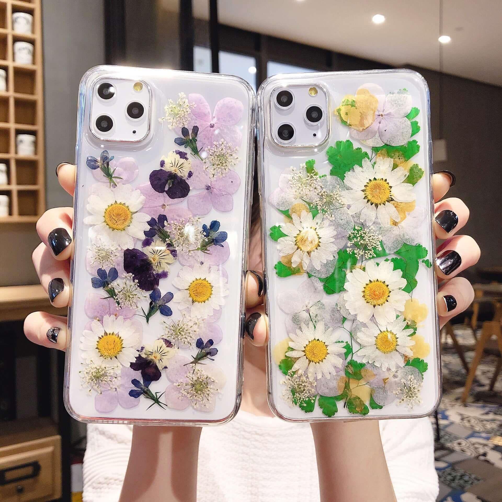Preserved flower phone cases featuring vibrant floral designs for iPhone models, showcasing nature's beauty.