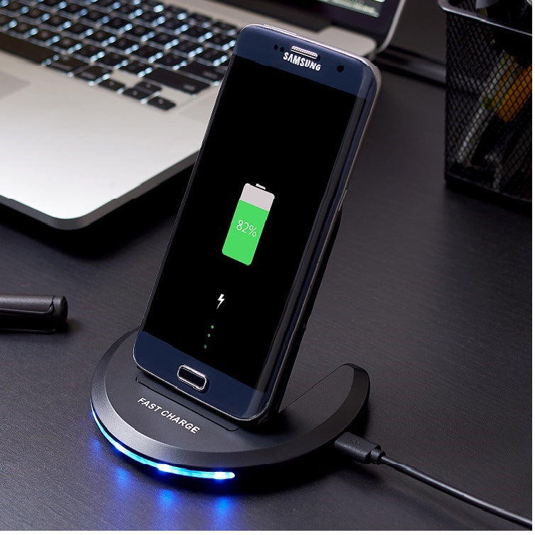 Mobile phone wireless charger bracket charger wireless charger fast charging wireless charger in use on a desk.