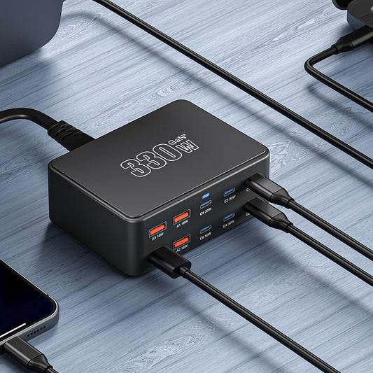 330W Super Fast Charge Porous Charger with multiple output ports on a wooden surface.