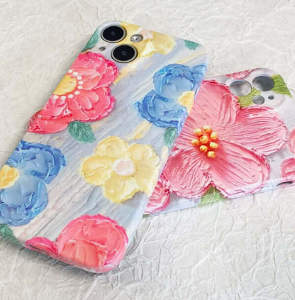 Customized acrylic couple phone cases with floral designs for iPhone models.