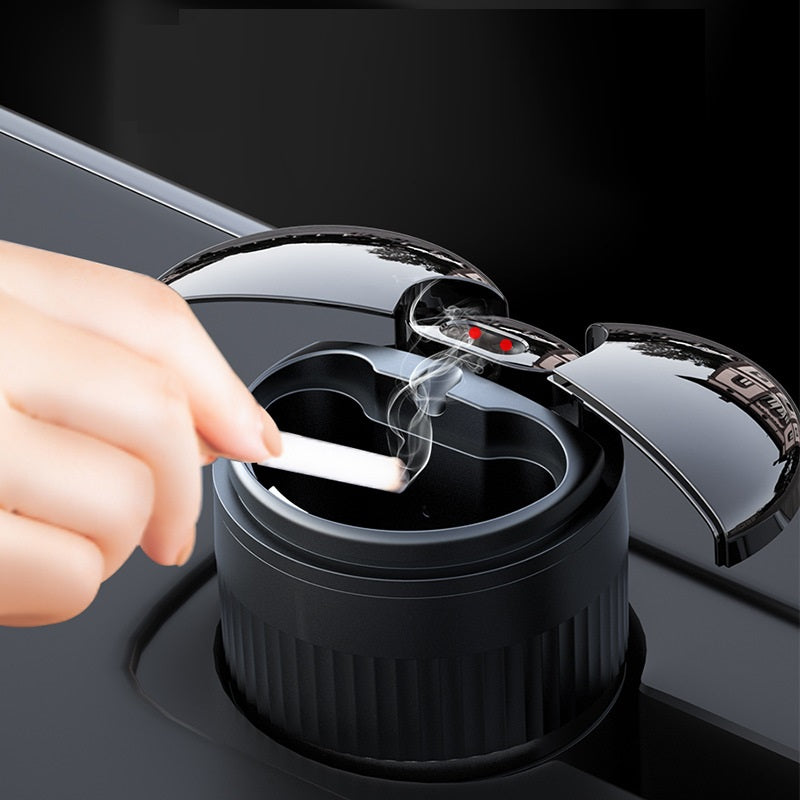 Multi-functional Creative Smart Car Ashtray With Lid in use, demonstrating USB charging and smoke elimination.