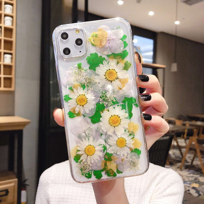 Preserved flower phone cases featuring colorful daisies and greenery in an epoxy design for stylish iPhone protection.