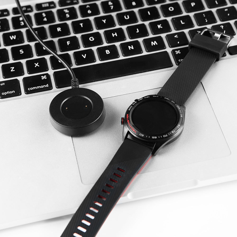 Watch Integrated Charging Cable and smartwatch on a laptop keyboard, showcasing convenient charging.